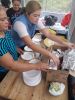Sabaneta - The headteacher and mums help to get the food ready to serve
