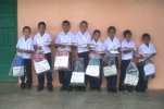 Children with their sponsorship satchels and school supplies